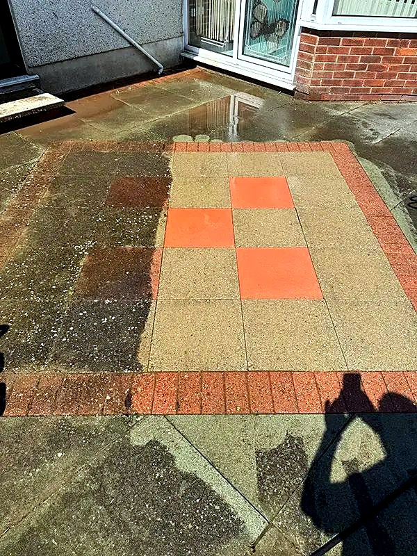 Patio with coloured paving slabs after cleaning